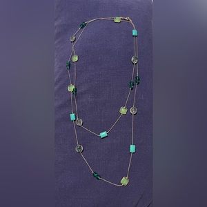 Long chain necklace with gold and green accents